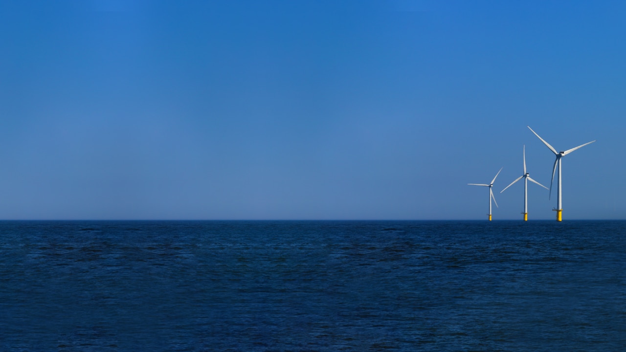 view of windmills of Rampion windfarm off the coast of Brighton, Sussex, UK