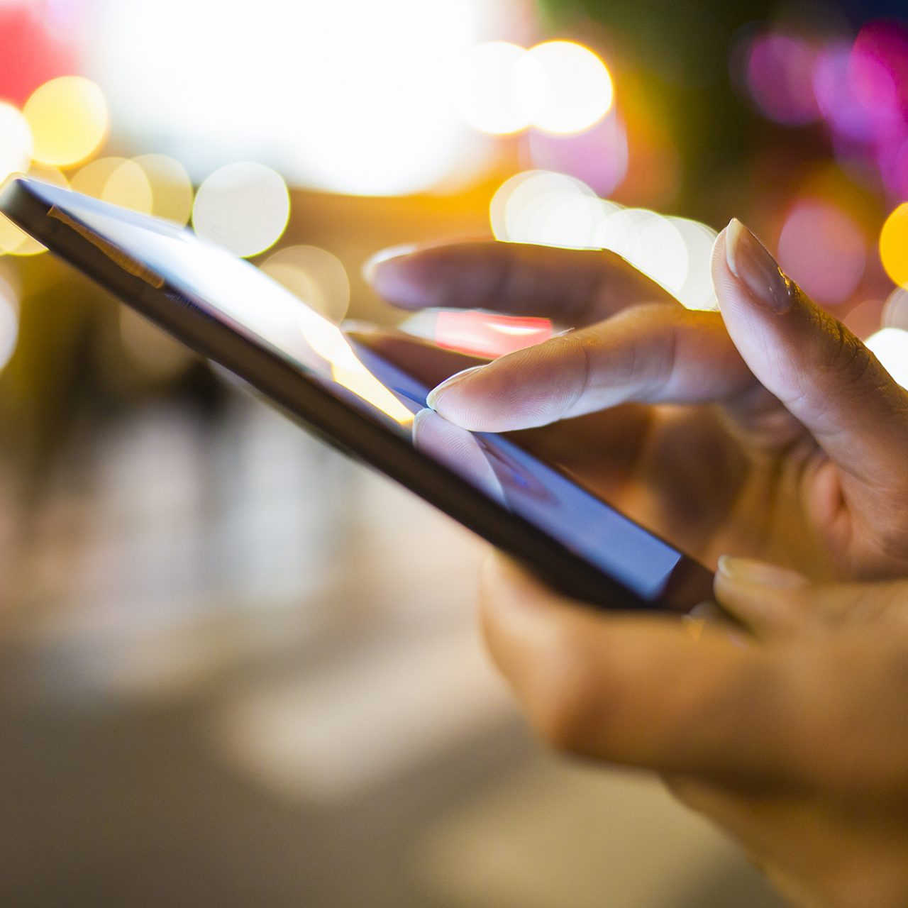 Woman using her Mobile Phone in the street