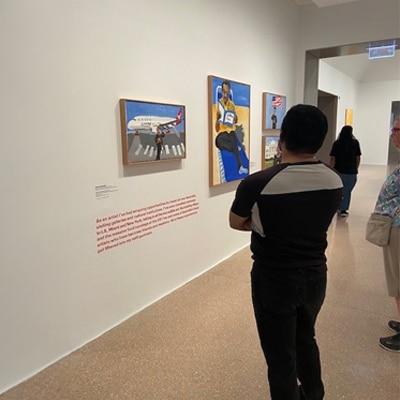Image: Vincent Namatjira’s Self Portrait (Leaving Home), 2019, on display at the Vincent Namatjira: Australia in colour exhibition at the National Gallery of Australia, Canberra.