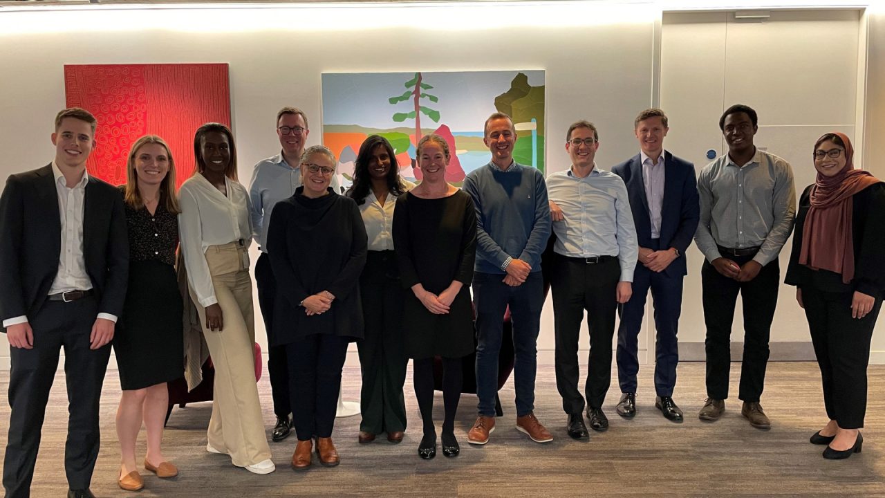 Courtney Lollback (second from left) and James Gardner (fourth from left) pictured with the Macquarie Group Foundation and GIF Investment pro bono team in London. 