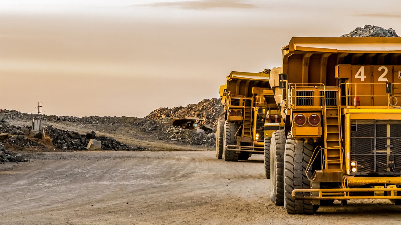 Dump Trucks transporting Platinum ore for processing