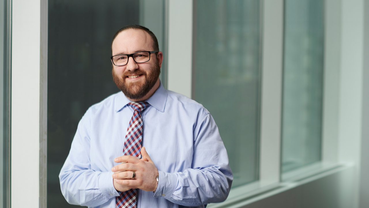 Man standing in front of wall